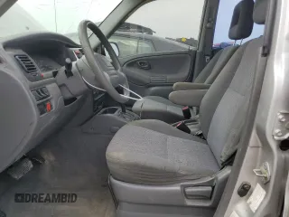 2002 Chevrolet Tracker z VIN 2CNBE13C926934704, wystawiony jako Copart lot #70717194 z przebiegiem 189 076 mil mil oraz Szkody całkowita. Historia ofert i sprzedaży dostępna na DreamBid. Obrazek 7.