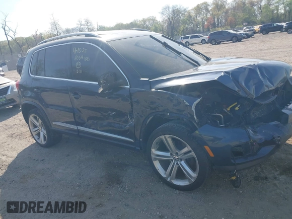 2014 Volkswagen Tiguan S z VIN WVGBV3AX7EW545538, wystawiony jako IAAI lot #42083281 z przebiegiem 129 227 mil mil oraz . Historia ofert i sprzedaży dostępna na DreamBid. Obrazek 1.