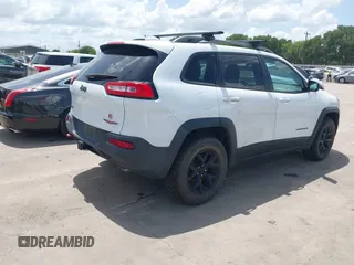 2014 Jeep Cherokee Trailhawk with VIN 1C4PJMBS5EW231448, listed as a IAAI auction lot 42632143 with 97,461 mi miles and . Bid and sale history available at DreamBid. Image 4.