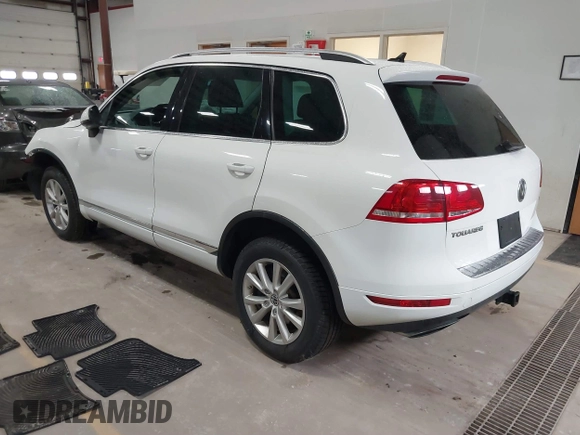 2014 Volkswagen Touareg Sport with VIN WVGEF9BP6ED005007, listed as a IAAI auction lot 41757033 with Not Provided miles and . Bid and sale history available at DreamBid. Image 3.