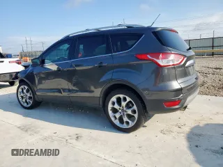 2015 Ford Escape Titanium with VIN 1FMCU0J97FUC88093, listed as a Copart auction lot 60854085 with 64,029 mi miles and Salvage title. Bid and sale history available at DreamBid. Image 2.