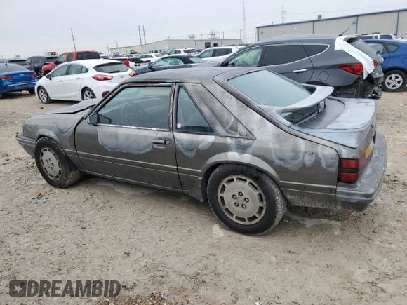 1986 Ford Mustang with VIN 1FABP28T8GF109009, listed as a Copart auction lot 83148544 with 329,005 mi miles and Salvage title. Bid and sale history available at DreamBid. Image 2.