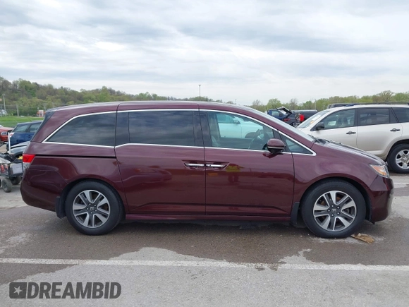 2014 Honda Odyssey Touring with VIN 5FNRL5H9XEB073156, listed as a IAAI auction lot 41990714 with 166,129 mi miles and . Bid and sale history available at DreamBid. Image 13.
