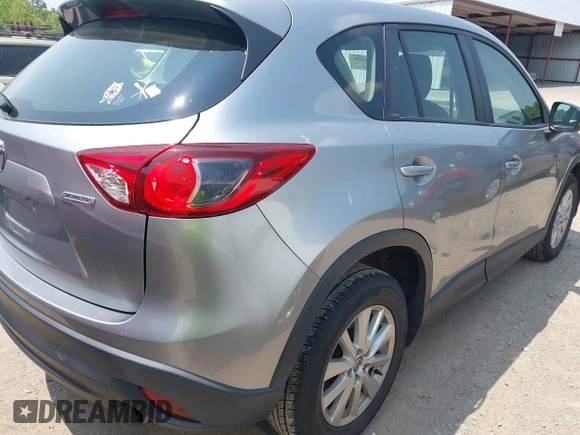 2014 Mazda CX-5 Sport with VIN JM3KE4BE9E0411177, listed as a IAAI auction lot 42411938 with 167,709 mi miles and . Bid and sale history available at DreamBid. Image 4.