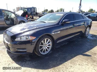 2012 Jaguar XJ with VIN SAJWA2GB9CLV27033, listed as a Copart auction lot 48719545 with 82,519 mi miles and Salvage Title. Bid and sale history available at carsss.com. Image 1.