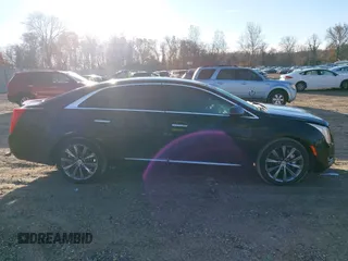 2013 Cadillac XTS z VIN 2G61N5S32D9238652, wystawiony jako IAAI lot #40966692 z przebiegiem 90 834 mil mil oraz . Historia ofert i sprzedaży dostępna na DreamBid. Obrazek 13.