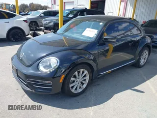 2017 Volkswagen Beetle 1.8T SE with VIN 3VWJ17ATXHM612411, listed as a IAAI auction lot 41900371 with 101,419 mi miles. Bid and sale history available at carsss.com. Image 2.
