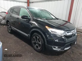 2018 Honda CR-V Touring with VIN 2HKRW2H99JH694227, listed as a IAAI auction lot 42187727 with 64,836 mi miles and . Bid and sale history available at DreamBid. Image 1.