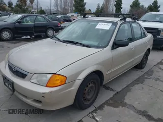2000 Mazda Protege DX with VIN JM1BJ2223Y0212144, listed as a IAAI auction lot 41570436 with 221,430 mi miles and . Bid and sale history available at DreamBid. Image 6.