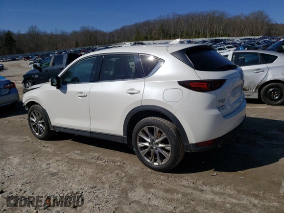 2021 Mazda CX-5 Grand Touring with VIN JM3KFBDM9M1426809, listed as a Copart auction lot 48468345 with 74,500 mi miles and Salvage Title. Bid and sale history available at carsss.com. Image 2.