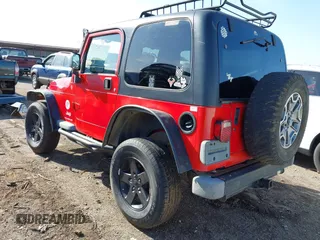2004 Jeep Wrangler Sport Right Hand Drive with VIN 1J4F449S74P796957, listed as a IAAI auction lot 41987562 with 106,730 mi miles and . Bid and sale history available at carsss.com. Image 3.