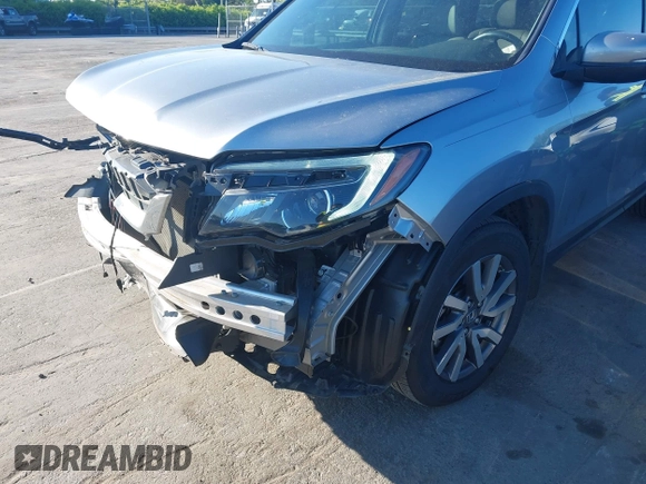 2020 Honda Pilot EX-L z VIN 5FNYF5H51LB016163, wystawiony jako IAAI lot #42030430 z przebiegiem 65 383 mil mil oraz . Historia ofert i sprzedaży dostępna na DreamBid. Obrazek 18.