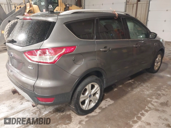 2014 Ford Escape SE with VIN 1FMCU9G95EUE19998, listed as a IAAI auction lot 42217195 with 163,934 mi miles and . Bid and sale history available at DreamBid. Image 4.