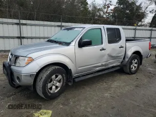 2010 Nissan Frontier SE with VIN 1N6AD0EV2AC405609, listed as a Copart auction lot 87615465 with 170,555 mi miles and Salvage title. Bid and sale history available at DreamBid. Image 1.