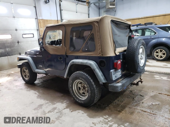 2000 Jeep Wrangler SE with VIN 1J4FA29P1YP739555, listed as a Copart auction lot 58501025 with 128,458 mi miles and Clean title. Bid and sale history available at DreamBid. Image 2.