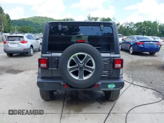 2022 Jeep Wrangler Unlimited Sahara Altitude z VIN 1C4HJXEG6NW103779, wystawiony jako IAAI lot #42563826 z przebiegiem 79 315 mil mil oraz . Historia ofert i sprzedaży dostępna na DreamBid. Obrazek 16.