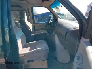 1999 Ford Econoline Cargo with VIN 1FDRE14W3XHB36482, listed as a IAAI auction lot 41393346 with 130,669 mi miles. Bid and sale history available at carsss.com. Image 5.