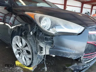 2012 Hyundai Veloster w/Gray Int z VIN KMHTC6AD0CU062046, wystawiony jako IAAI lot #42182993 z przebiegiem 148 574 mil mil oraz . Historia ofert i sprzedaży dostępna na DreamBid. Obrazek 6.