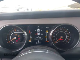 2023 Jeep Gladiator High Altitude z VIN 1C6HJTFG0PL504618, wystawiony jako IAAI lot #41877983 z przebiegiem 26 402 mil mil oraz . Historia ofert i sprzedaży dostępna na DreamBid. Obrazek 7.