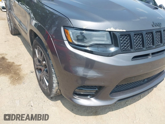 2018 Jeep Grand Cherokee SRT z VIN 1C4RJFDJ7JC281644, wystawiony jako IAAI lot #42481239 z przebiegiem 160 218 mil mil oraz . Historia ofert i sprzedaży dostępna na DreamBid. Obrazek 6.