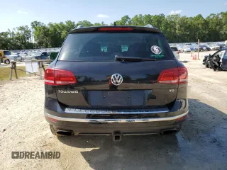 2015 Volkswagen Touareg Lux с VIN WVGEP9BP4FD004212, выставлен на аукционе Copart как лот 54021345 с пробегом 156 164 миль миль и Списание • Salvage title. История ставок и продаж доступна на DreamBid. Изображение 6.