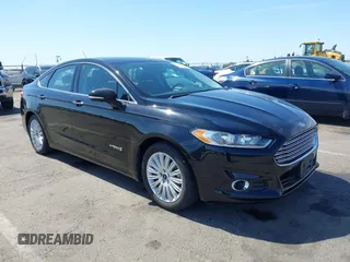 2016 Ford Fusion SE Hybrid z VIN 3FA6P0LU9GR405102, wystawiony jako IAAI lot #42358807 z przebiegiem 91 130 mil mil oraz . Historia ofert i sprzedaży dostępna na DreamBid. Obrazek 1.