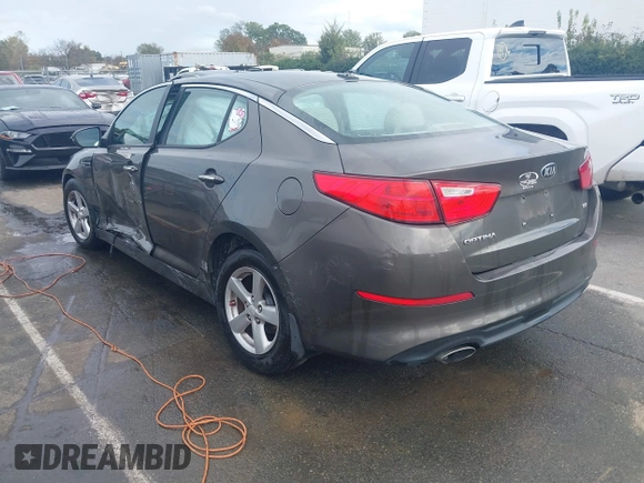 2015 Kia Optima LX with VIN 5XXGM4A72FG400848, listed as a IAAI auction lot 40802198 with 173,270 mi miles and . Bid and sale history available at DreamBid. Image 3.