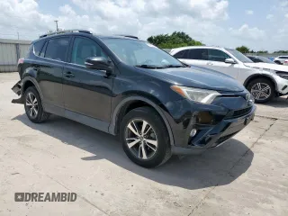 2018 Toyota RAV4 XLE with VIN 2T3WFREV2JW433186, listed as a Copart auction lot 61008705 with 57,310 mi miles and Salvage title. Bid and sale history available at DreamBid. Image 4.
