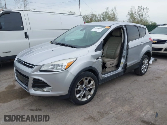 2013 Ford Escape SEL with VIN 1FMCU0HX1DUB81641, listed as a IAAI auction lot 42090788 with 111,496 mi miles and . Bid and sale history available at DreamBid. Image 2.