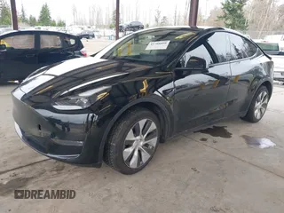 2023 Tesla Model Y Long Range with VIN 7SAYGDEE4PF789102, listed as a IAAI auction lot 41788860 with 88,457 mi miles and . Bid and sale history available at DreamBid. Image 2.