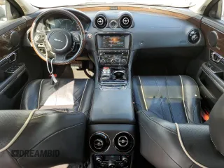 2015 Jaguar XJ Portfolio with VIN SAJWJ2GD2F8V75238, listed as a Copart auction lot 73633984 with 102,545 mi miles and Salvage title. Bid and sale history available at DreamBid. Image 8.