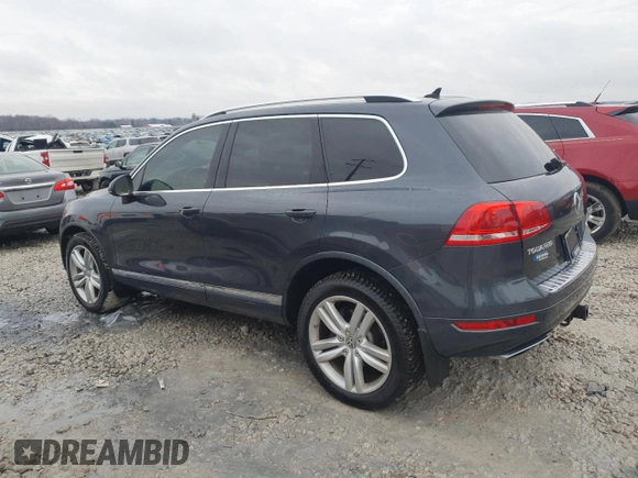 2012 Volkswagen Touareg Sport z VIN WVGFK9BP6CD005005, wystawiony jako Copart lot #46802355 z przebiegiem 141 430 mil mil oraz Czysty tytuł • Clean title. Historia ofert i sprzedaży dostępna na DreamBid. Obrazek 2.