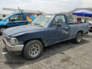 1989 Toyota Pickup DX z VIN JT4RN81P8K5015967, wystawiony jako Copart lot #62917714 z przebiegiem 346 246 mil mil oraz Czysty tytuł • Clean title. Historia ofert i sprzedaży dostępna na DreamBid. Obrazek 1.