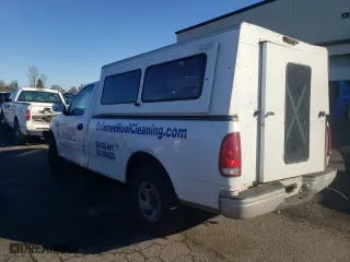 1999 Ford F-150 Work Series with VIN 1FTRF17W9XKB35000, listed as a Copart auction lot 86001964 with 155,055 mi miles and Salvage Title. Bid and sale history available at carsss.com. Image 2.
