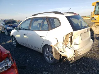 2009 Kia Rondo LX Base with VIN KNAFG528597268730, listed as a Copart auction lot 77071064 with 151,159 mi miles and Salvage Title. Bid and sale history available at carsss.com. Image 2.