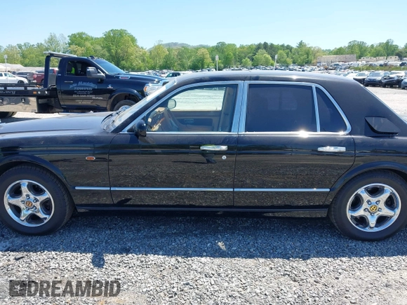 1999 Bentley Arnage z VIN SCBLB51E1XCX01401, wystawiony jako IAAI lot #42133144 z przebiegiem 29 699 mil mil oraz . Historia ofert i sprzedaży dostępna na DreamBid. Obrazek 14.