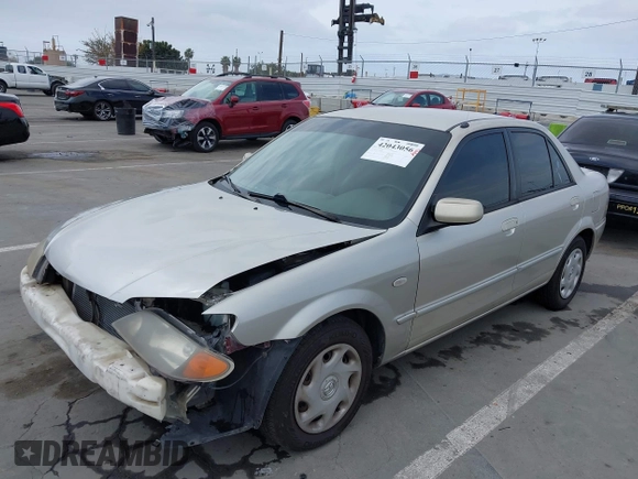 2002 Mazda Protege DX with VIN JM1BJ225121620394, listed as a IAAI auction lot 42043056 with 187,360 mi miles and . Bid and sale history available at DreamBid. Image 2.