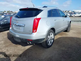 2014 Cadillac SRX Performance Collection with VIN 3GYFNCE39ES544135, listed as a IAAI auction lot 41808644 with 145,772 mi miles and . Bid and sale history available at carsss.com. Image 4.