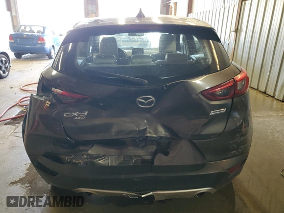 2016 Mazda CX-3 Grand Touring z VIN JM1DKFD74G0137815, wystawiony jako Copart lot #52405765 z przebiegiem 128 922 mil mil oraz Szkoda całkowita • Salvage title. Historia ofert i sprzedaży dostępna na DreamBid. Obrazek 6.