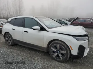 2023 BMW iX xDrive50 with VIN WB523CF04PCL67044, listed as a Copart auction lot 82805014 with 12,858 mi miles and Salvage Title. Bid and sale history available at carsss.com. Image 4.