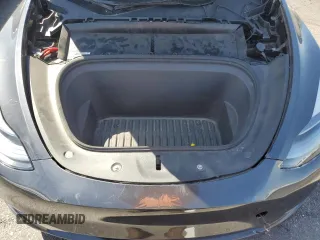 2024 Tesla Model Y with VIN 7SAYGDED1RF052031, listed as a Copart auction lot 61806195 with 5,365 mi miles and Salvage title. Bid and sale history available at DreamBid. Image 12.