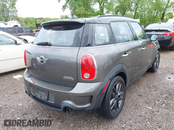 2011 MINI Countryman S with VIN WMWZC5C53BWM11022, listed as a IAAI auction lot 42249403 with 173,718 mi miles and . Bid and sale history available at DreamBid. Image 4.