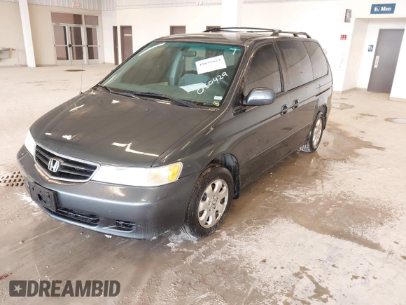 2004 Honda Odyssey EX z VIN 5FNRL18674B050429, wystawiony jako IAAI lot #41655622 z przebiegiem 257 656 mil mil oraz . Historia ofert i sprzedaży dostępna na DreamBid. Obrazek 2.