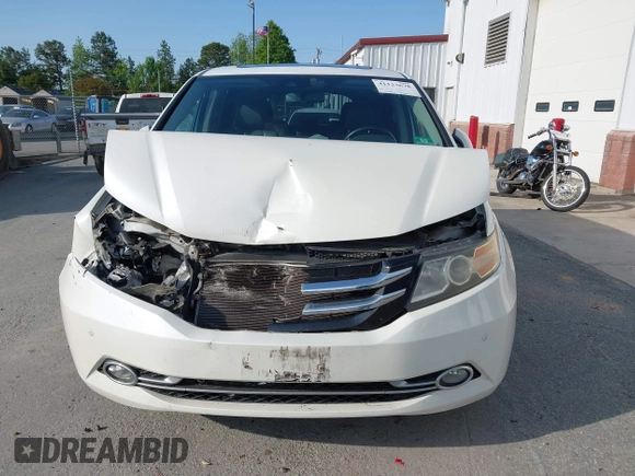 2014 Honda Odyssey Touring with VIN 5FNRL5H94EB001479, listed as a IAAI auction lot 41123678 with 147,269 mi miles and . Bid and sale history available at carsss.com. Image 12.