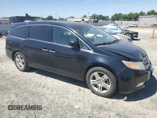 2012 Honda Odyssey Touring with VIN 5FNRL5H95CB004226, listed as a Copart auction lot 55775235 with 157,521 mi miles and Clean Title. Bid and sale history available at DreamBid. Image 4.