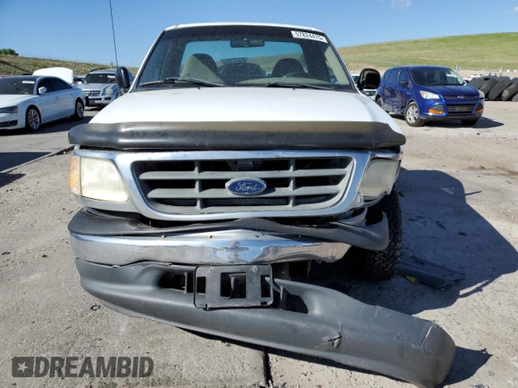 2001 Ford F-150 XL z VIN 3FTZF17211MA71306, wystawiony jako Copart lot #57824475 z przebiegiem 186 866 mil mil oraz Szkoda całkowita • Salvage title. Historia ofert i sprzedaży dostępna na DreamBid. Obrazek 5.