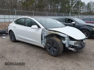 2020 Tesla Model 3 Standard Range Plus with VIN 5YJ3E1EA1LF799766, listed as a IAAI auction lot 41386508 with 90,000 mi miles. Bid and sale history available at carsss.com. Image 1.