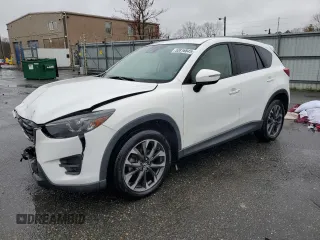 2016 Mazda CX-5 Grand Touring z VIN JM3KE4DY7G0865079, wystawiony jako Copart lot #52816845 z przebiegiem 116 251 mil mil oraz Szkoda całkowita • Salvage title. Historia ofert i sprzedaży dostępna na DreamBid. Obrazek 1.