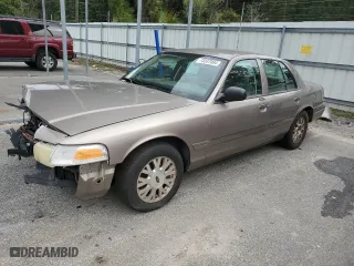 2005 Ford Crown Victoria LX with VIN 2FAFP74W95X126417, listed as a Copart auction lot 73537004 with 246,163 mi miles and Salvage Title. Bid and sale history available at carsss.com. Image 1.