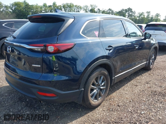 2021 Mazda CX-9 Touring with VIN JM3TCBCY7M0507699, listed as a IAAI auction lot 42603614 with 62,635 mi miles and . Bid and sale history available at DreamBid. Image 4.